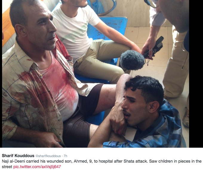 47_Naji_al-Deeni_carried_his_wounded_son,_Ahmed,_9_AGC3